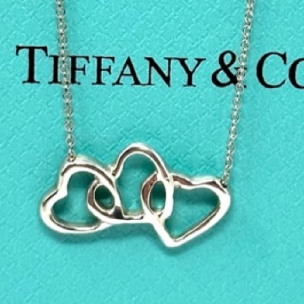 Authentic Tiffany & CO.  Triple open Hearts Pendant Necklace.